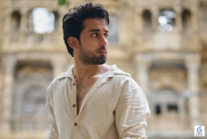 Bilal Abbas Khan smiling during a promotional photoshoot for a Pakistani television drama