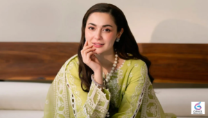 Hania Aamir smiling during a photoshoot, showcasing her successful acting career, popular dramas, personal life, and achievements in Pakistan's entertainment industry.