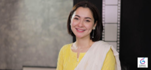 Hania Aamir posing confidently for a photoshoot, highlighting her successful acting career, popular dramas, and growing fame in the entertainment industry.