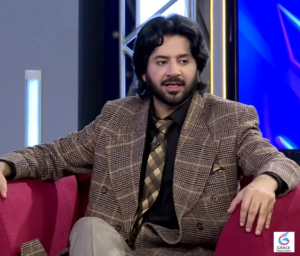 Imran Ashraf posing during a television event.