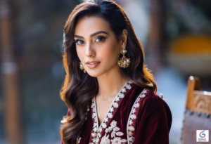 Iqra Aziz, popular Pakistani actress, smiling in an elegant pose highlighting her beauty and successful television career.