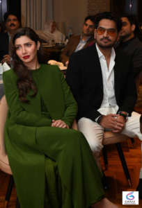 Mahira Khan smiling in a stylish outfit during a public appearance, highlighting the Pakistani actress known for Humsafar, Raees, and Superstar.