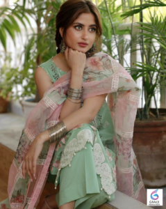 Sajal Ali posing gracefully in a stylish outfit during a professional photoshoot, highlighting the Pakistani actress known for her hit dramas, films, and elegant personality in 2026.