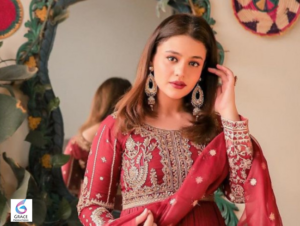 Zara Noor Abbas smiling in a traditional elegant outfit at a public event
