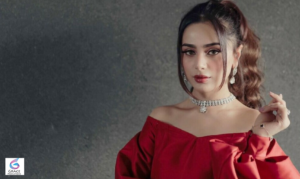 Pakistani singer Aima Baig posing confidently in a fashionable outfit during a professional photoshoot.