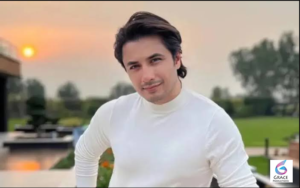 Pakistani singer and actor Ali Zafar smiling at a media event.