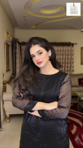 Alina Amir showcasing her elegant style in a stunning portrait for her complete profile.
