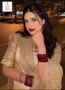 Alina Amir smiling during a stylish portrait showcasing her modern fashion and confident personality.
