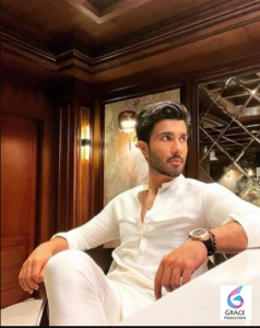 Feroze Khan smiling during a professional portrait showcasing the Pakistani actor's signature style