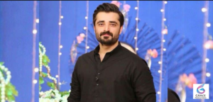 Hamza Ali Abbasi posing during a public event in 2026, showcasing the Pakistani actor's signature style and confident personality.