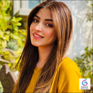 Kinza Hashmi posing in a stylish traditional outfit during a professional photoshoot