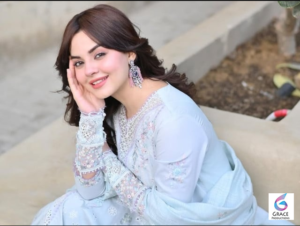 Komal Meer posing gracefully in a stylish traditional outfit during a professional photoshoot.