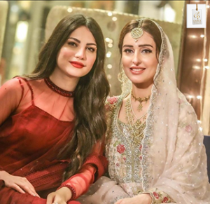 Sidra Niazi smiling during a stylish photoshoot showcasing her elegant look and personality