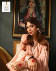 Sonya Hussyn smiling during a professional portrait session, showcasing the grace and confidence that define her successful acting career.