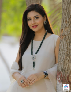 Elegant portrait of Pakistani actress and fashion model Sunita Marshall smiling during a professional photoshoot.