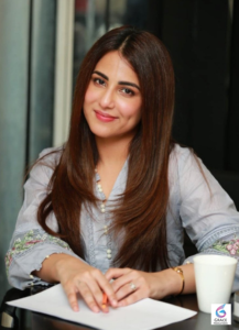 Ushna Shah smiling during a photoshoot in 2026, showcasing the Pakistani actress known for her hit TV dramas and elegant style.