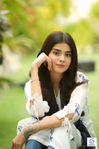 Zainab Shabbir smiling in an elegant traditional dress during a photoshoot, highlighting her graceful style and successful Pakistani television career.