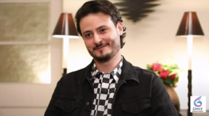 Osman Khalid Butt posing in a stylish outfit during a public event, showcasing the popular Pakistani actor, writer, and television star in 2026.