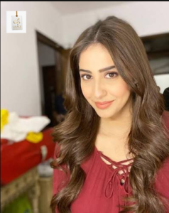 Alina Khan posing for a portrait in a stylish look