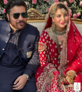 Areeba Habib smiling in a stunning traditional outfit at a public appearance