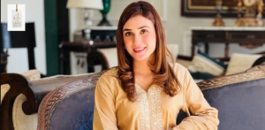 Hina Tariq posing in a stylish outfit during a professional photoshoot for her Pakistani television career.