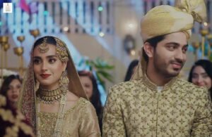 Iqra Aziz and Talha Chahour during a scene from Mannat Murad drama