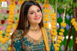 Maria Malik smiling during a television industry appearance