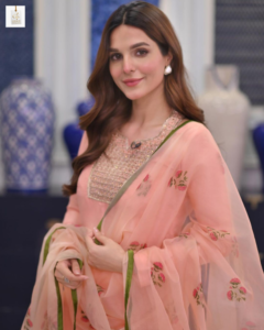 Mehrunisa Iqbal posing elegantly in a traditional Pakistani outfit