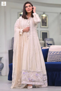 Nida Yasir smiling during a television appearance
