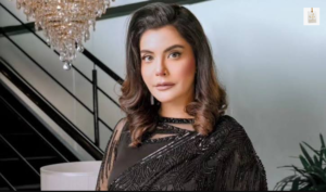 Nida Yasir posing for a portrait in a stylish traditional outfit