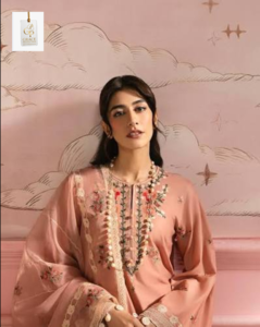 Syra Yousuf posing for a professional photoshoot in an elegant outfit